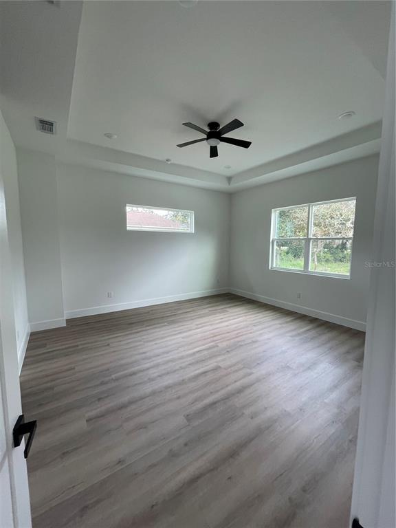 41719 Aspen Street Eustis, FL 32736 - Photo 35 of 52 wooden floor in an empty room with a window