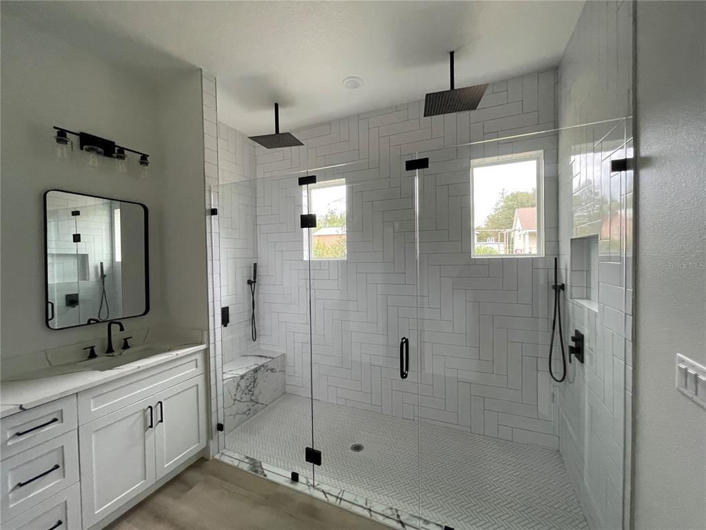 41719 Aspen Street Eustis, FL 32736 - Photo 40 of 52 a spacious bathroom with a double vanity sink mirror and shower