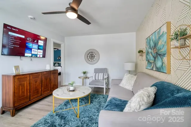 a living room with furniture and a table