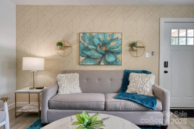 a living room with furniture and a lamp