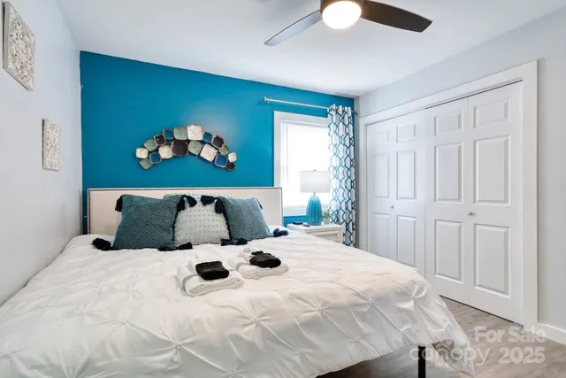 a large white bed in a white room