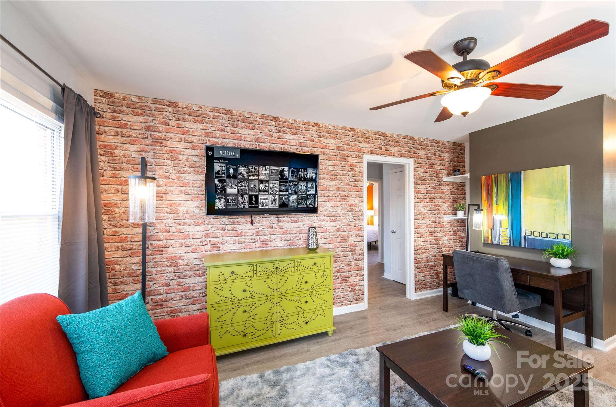3337 Washburn Avenue Charlotte, NC 28205 - Photo 2 of 23 a living room with furniture and a flat screen tv