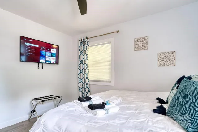 a bedroom with a bed and a window