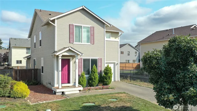 a front view of a house with a yard