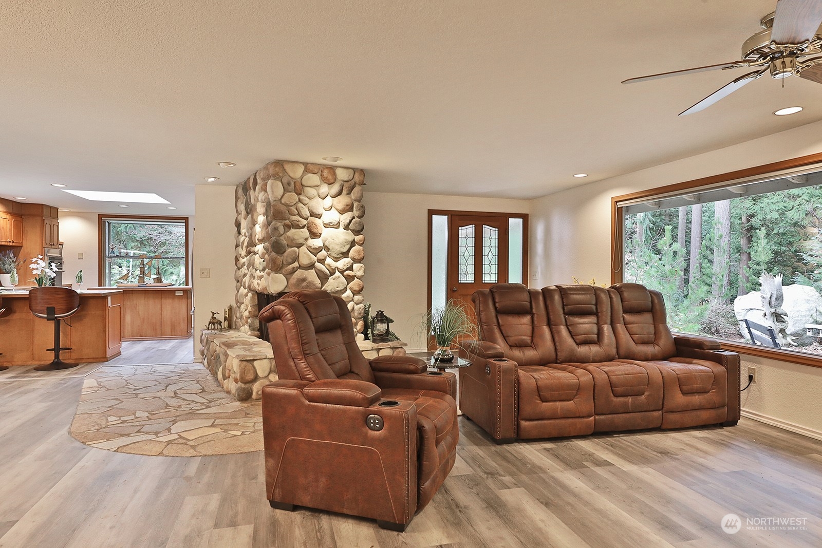 5003 East Harbor Road Freeland, WA 98249 - Photo 11 of 40 a living room with furniture large window and outer view