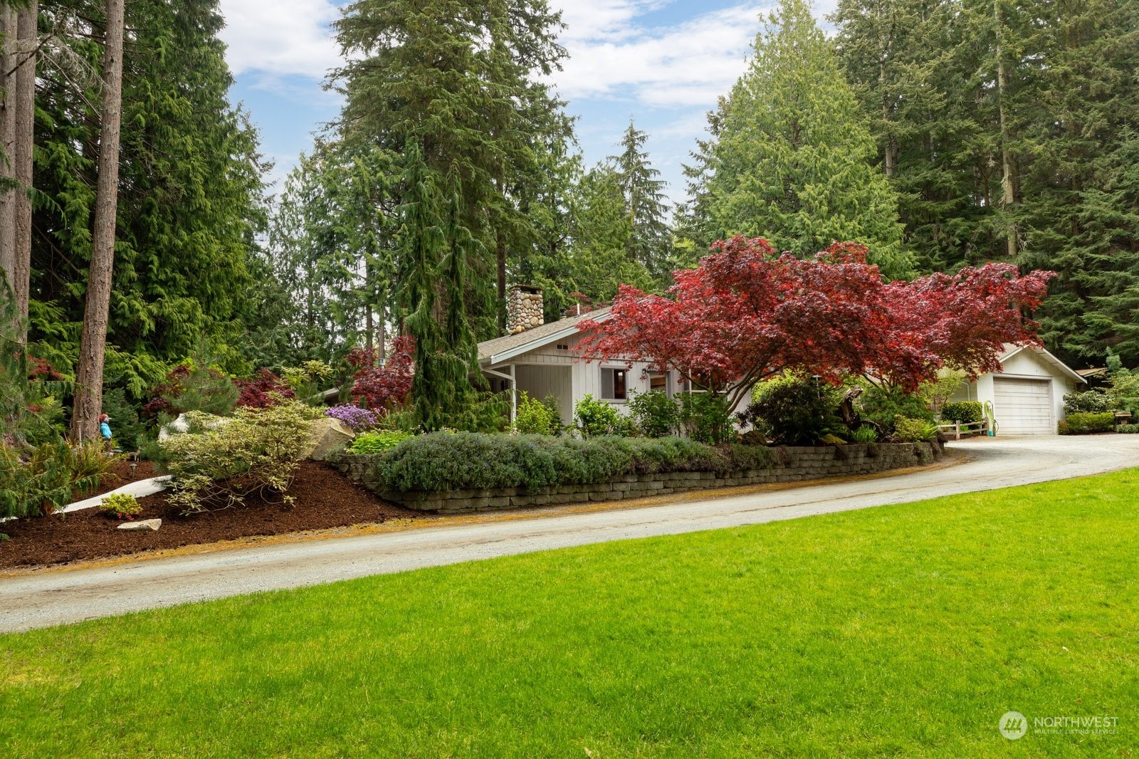 5003 East Harbor Road Freeland, WA 98249 - Photo 2 of 40 a view of a house with garden