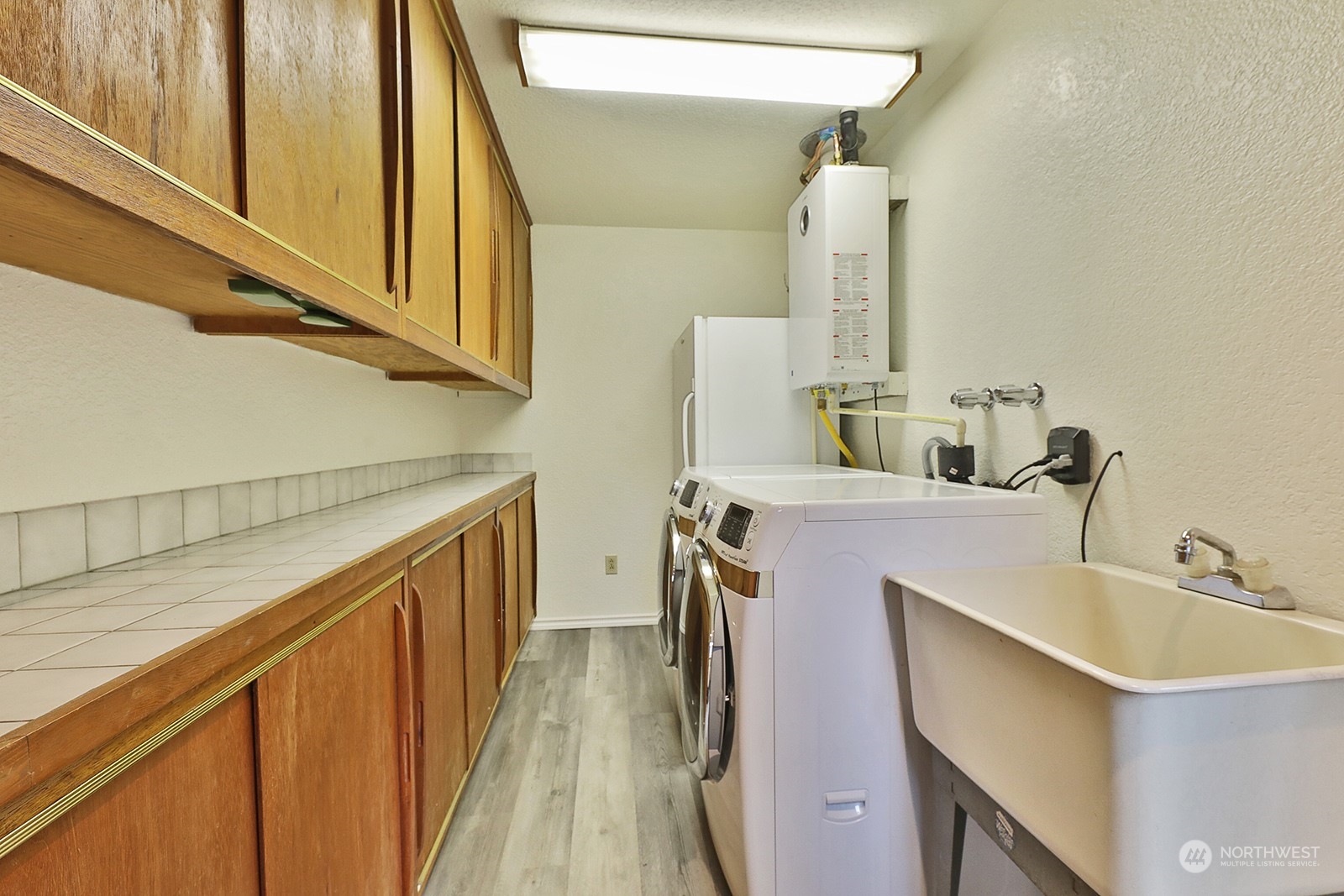 5003 East Harbor Road Freeland, WA 98249 - Photo 23 of 40 a bathroom with a sink and a mirror