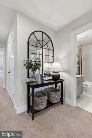 a bedroom with a bed and a mirror