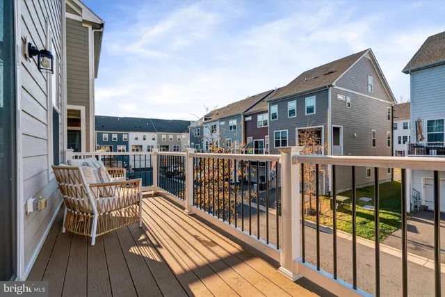 a view of a livingroom with furniture and a ceiling fan