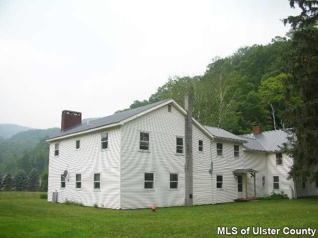 684 Sundown Road Grahamsville, NY 12740 - Photo 3 of 4 a view of white house with a yard