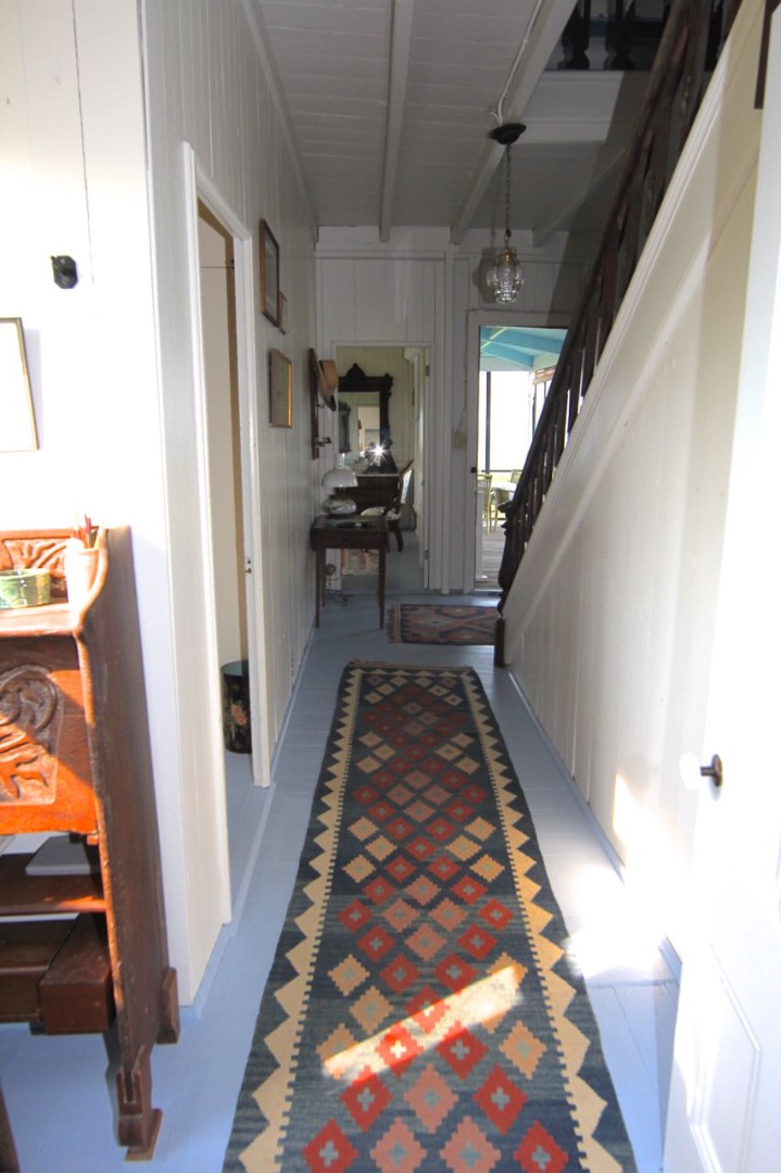 8 Calebs Pond Road Edgartown, MA 02539 - Photo 13 of 49 a view of a hallway to a livingroom with furniture wooden floor and windows