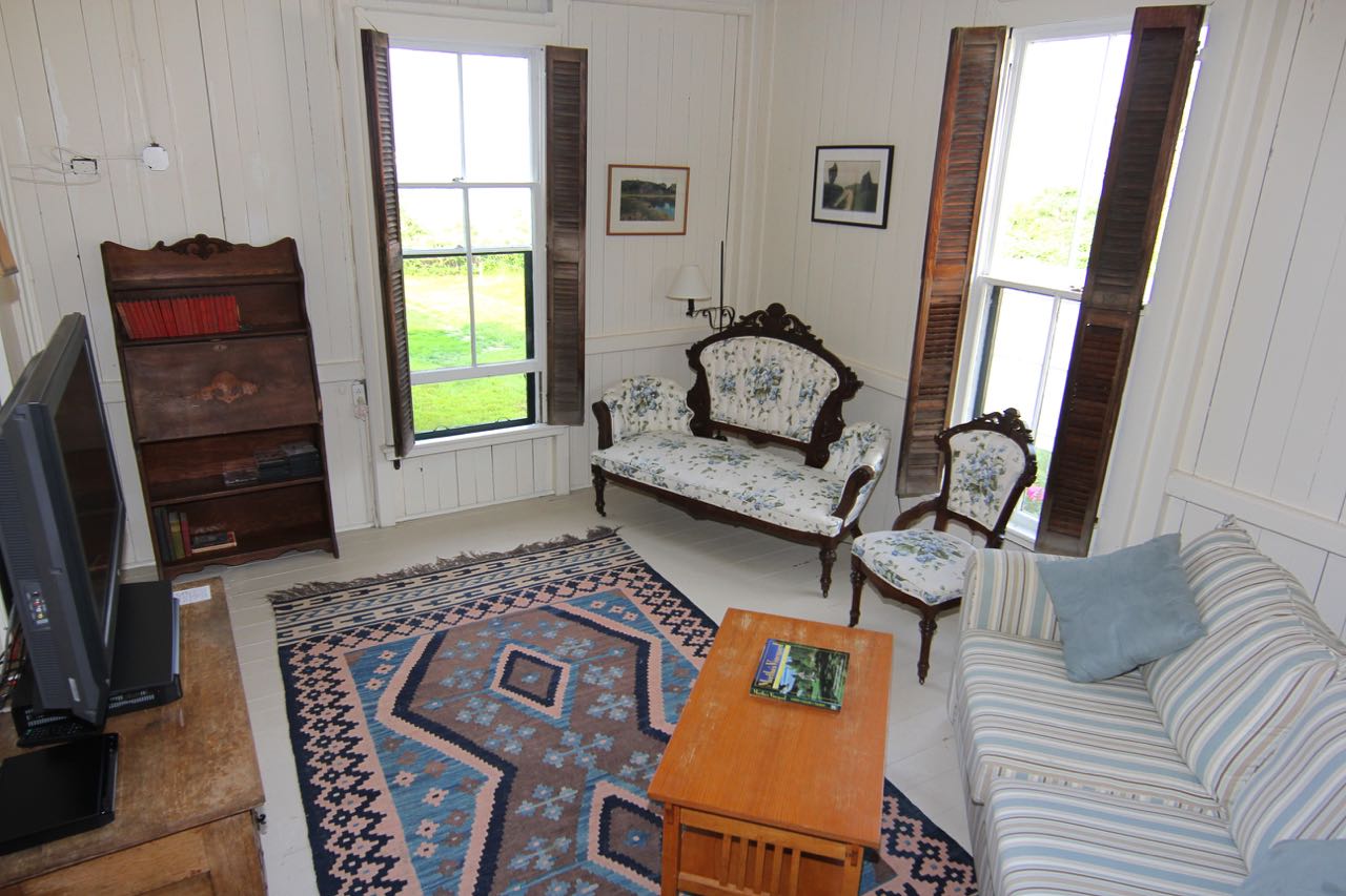 8 Calebs Pond Road Edgartown, MA 02539 - Photo 18 of 49 a living room with furniture and a window