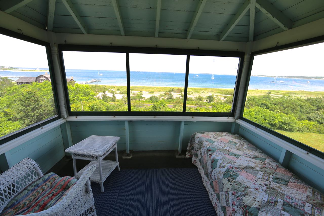 8 Calebs Pond Road Edgartown, MA 02539 - Photo 28 of 49 a balcony with furniture and a garden