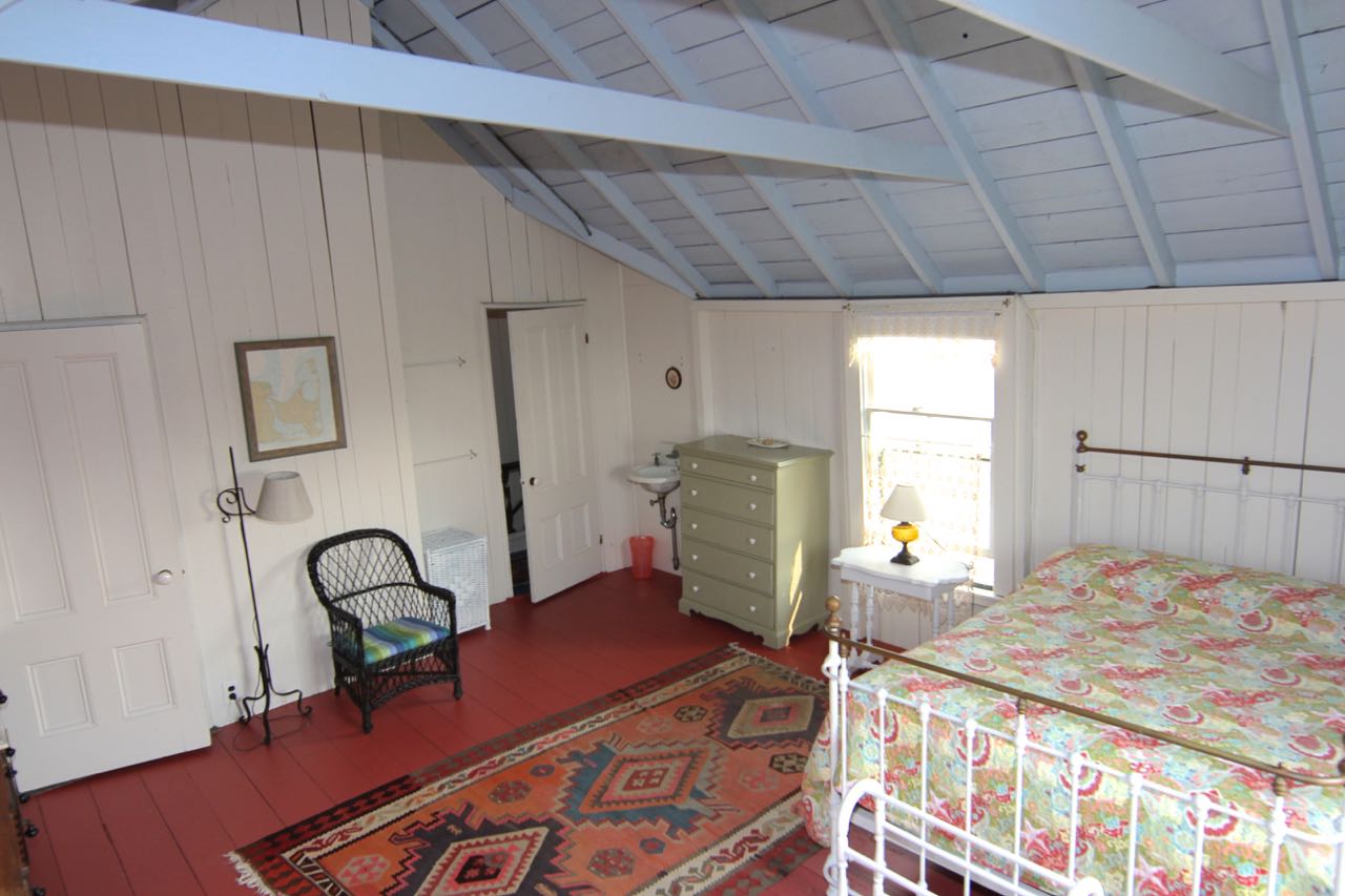 8 Calebs Pond Road Edgartown, MA 02539 - Photo 34 of 49 a bed sitting in a spacious bedroom next to a window