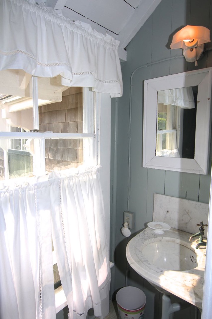 8 Calebs Pond Road Edgartown, MA 02539 - Photo 37 of 49 a bathroom with a sink toilet and shower