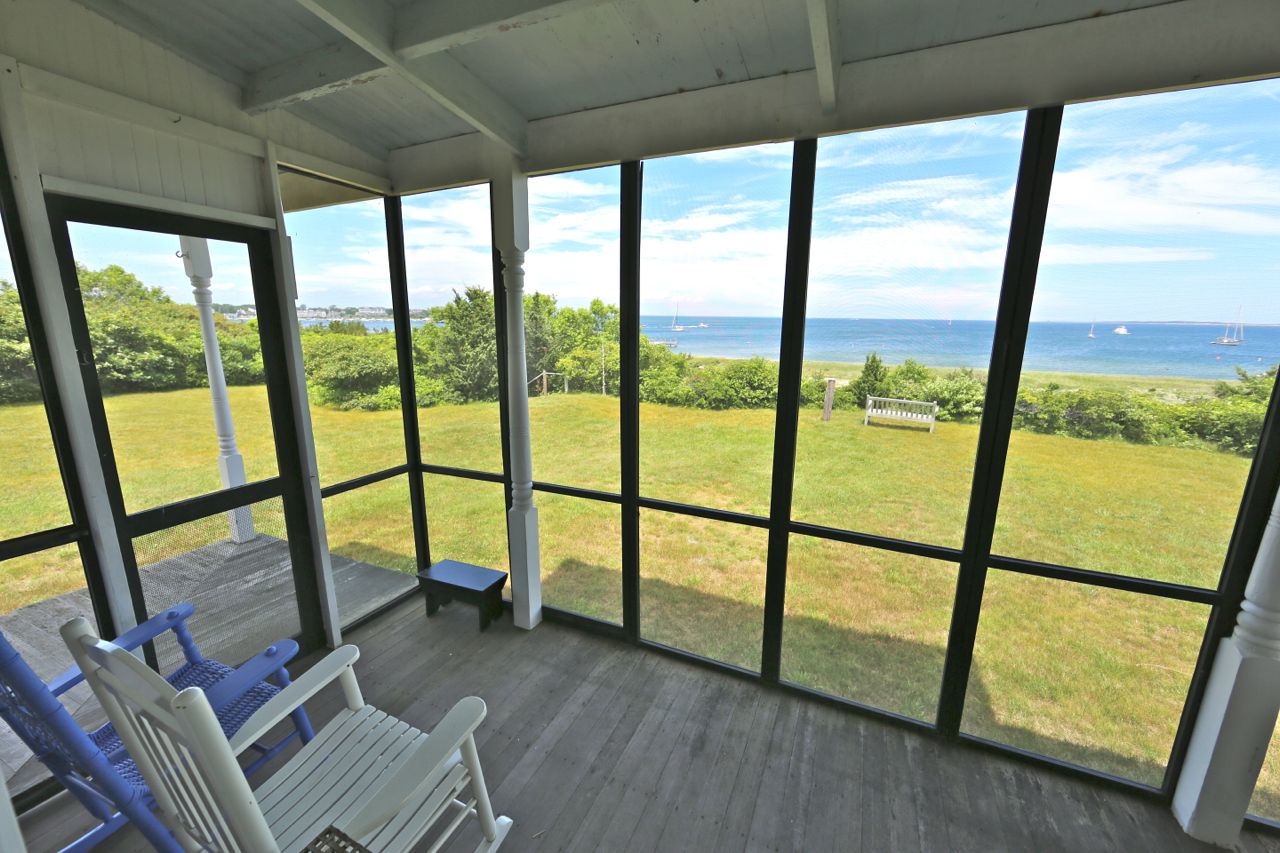 8 Calebs Pond Road Edgartown, MA 02539 - Photo 41 of 49 a view of an empty room with wooden floor and furniture