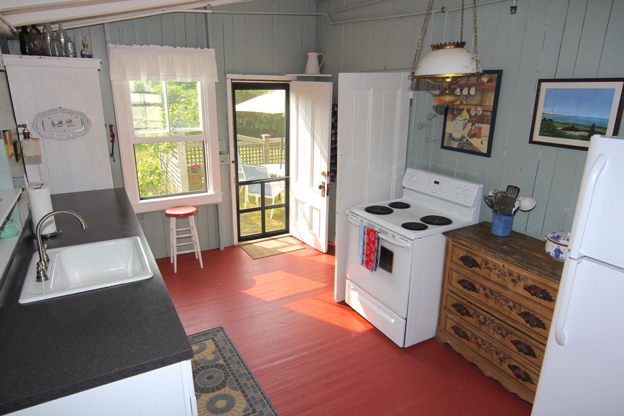 8 Calebs Pond Road Edgartown, MA 02539 - Photo 8 of 49 a view of kitchen with window and furniture