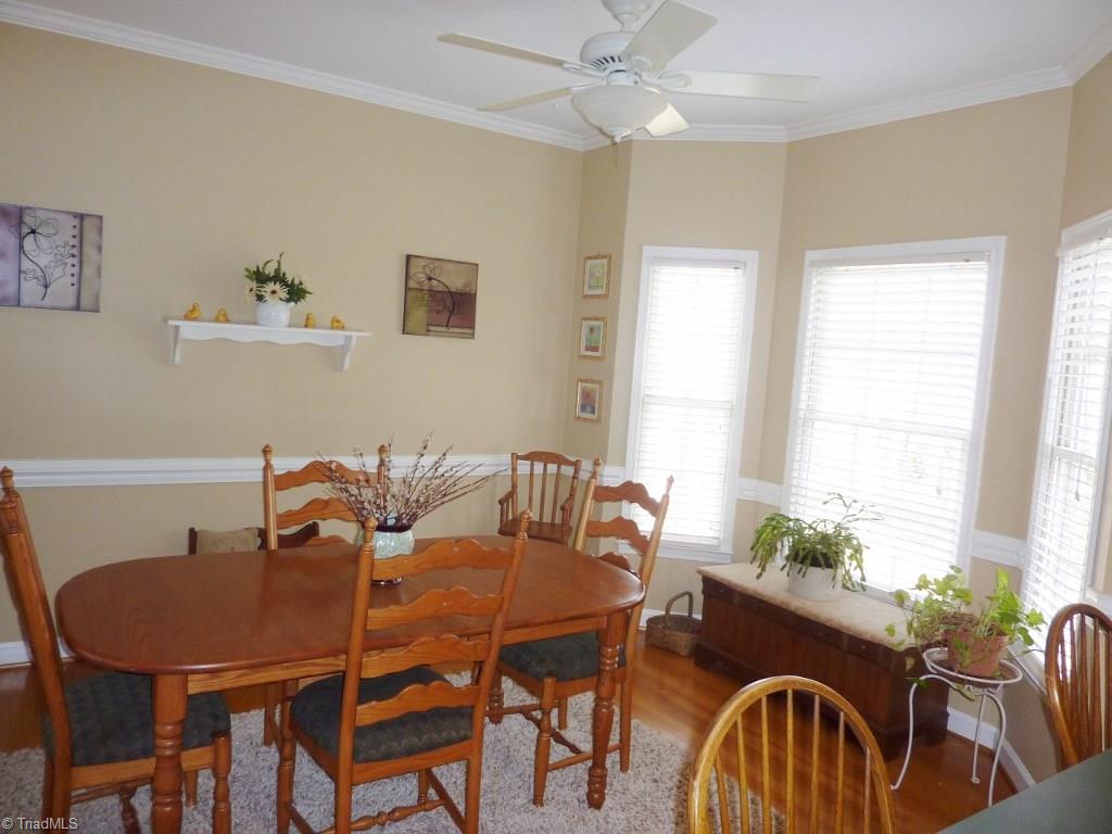 6325 Armsby Road Clemmons, NC 27012 - Photo 12 of 30 Large Breakfast Room with ceiling fan, chair rail, and bay area for extra space and natural lighting!