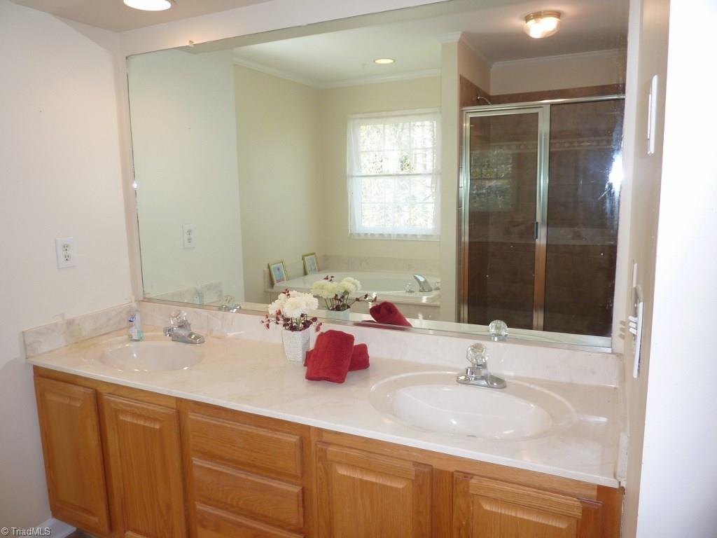6325 Armsby Road Clemmons, NC 27012 - Photo 18 of 30 Master Bath has double sinks, drawers and cabinets for storage, jetted tub, and separate shower!