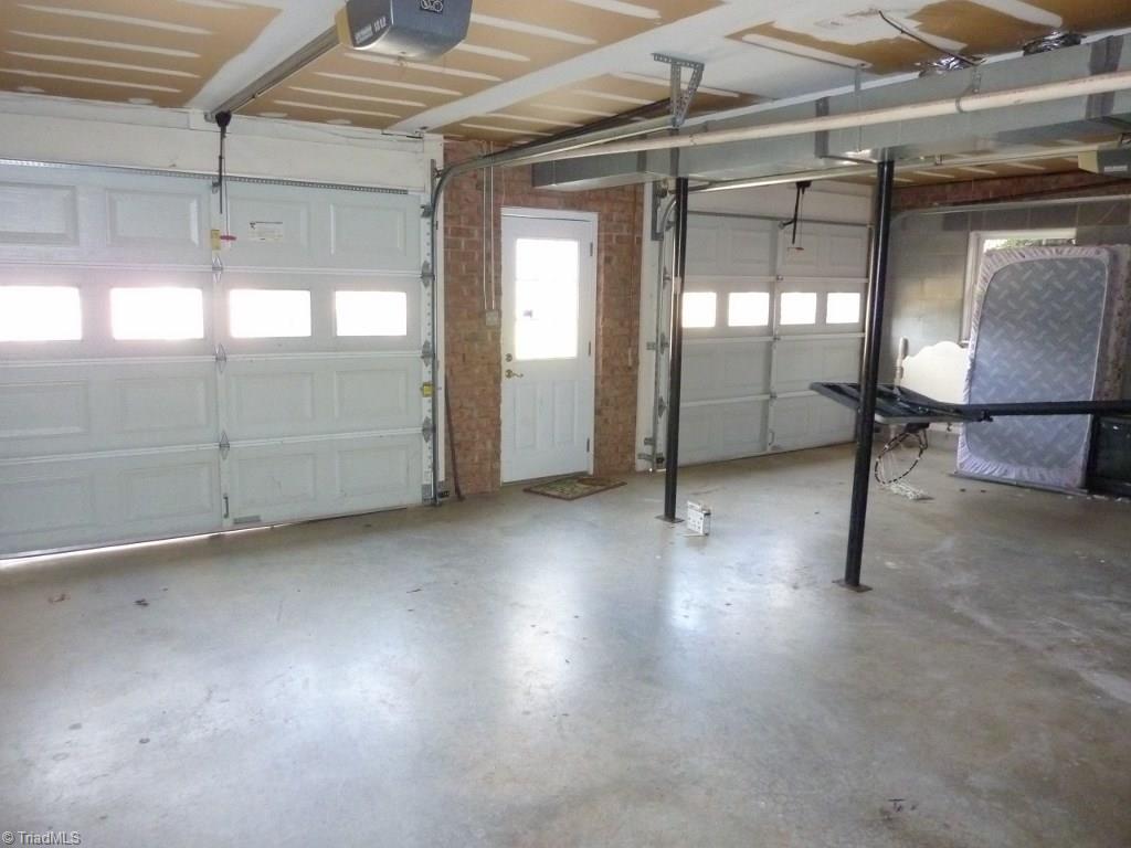 6325 Armsby Road Clemmons, NC 27012 - Photo 25 of 30 Oversized 2 Car Garage with a door to the driveway and space for storage!