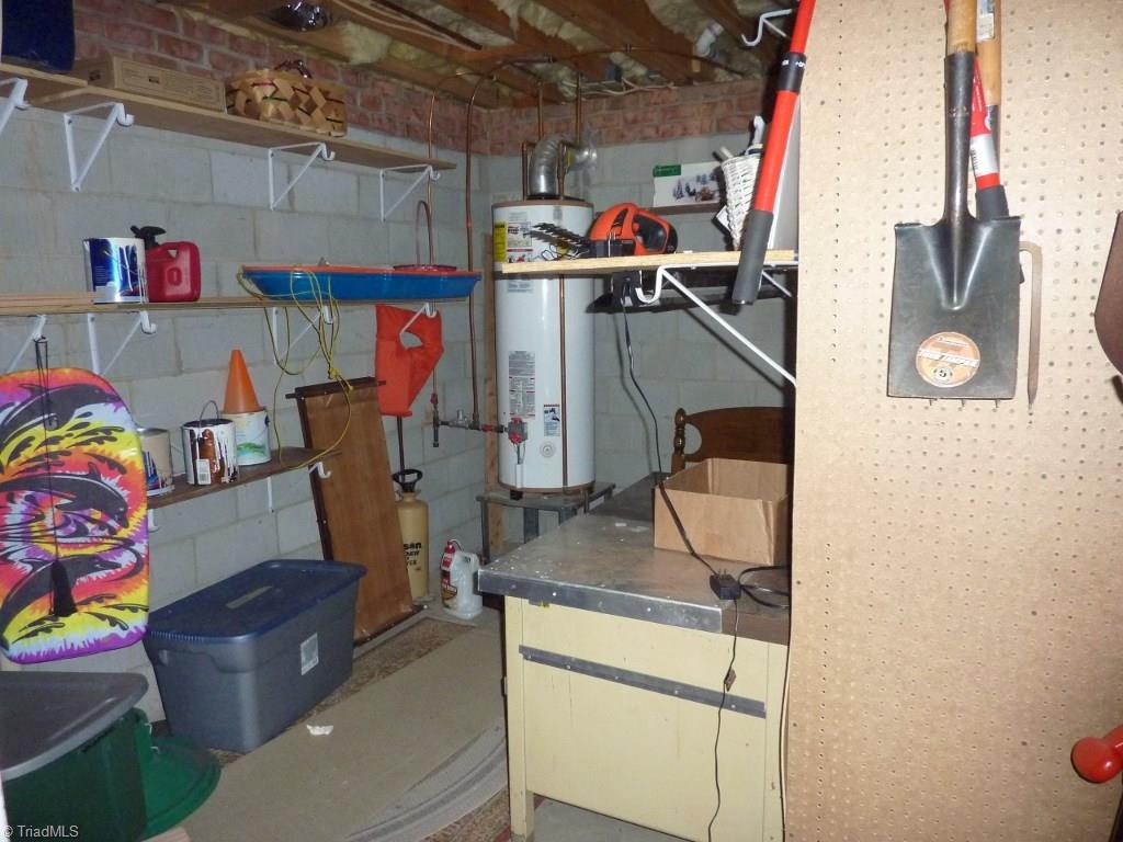 6325 Armsby Road Clemmons, NC 27012 - Photo 26 of 30 Storage room with shelves or space for a workshop - off the garage where the gas water heater is.
