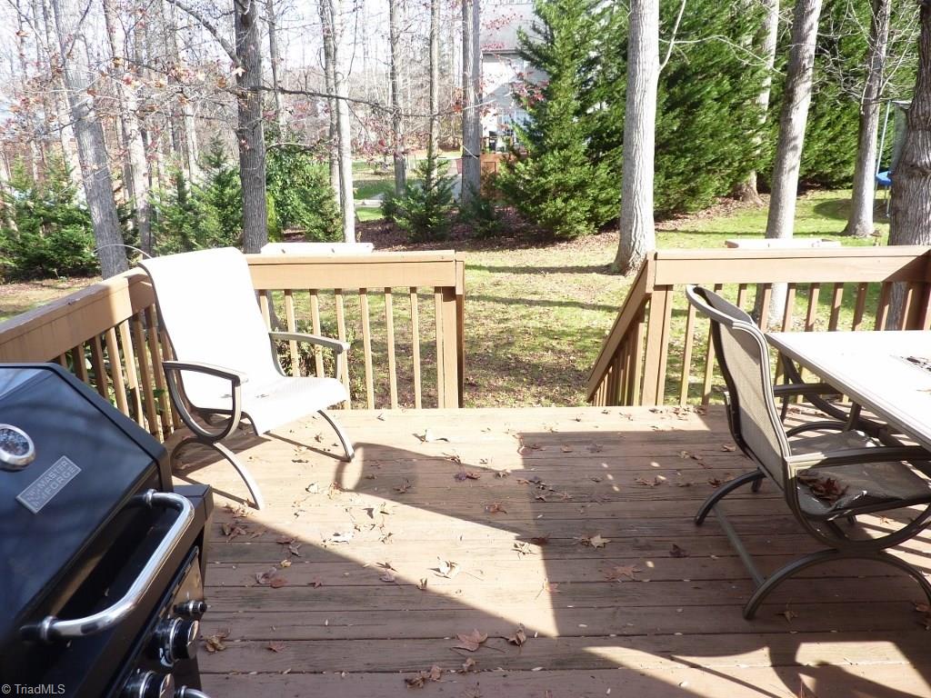 6325 Armsby Road Clemmons, NC 27012 - Photo 28 of 30 Spacious Deck off the Great Room overlooks the partially cleared yard with mature landscaping!