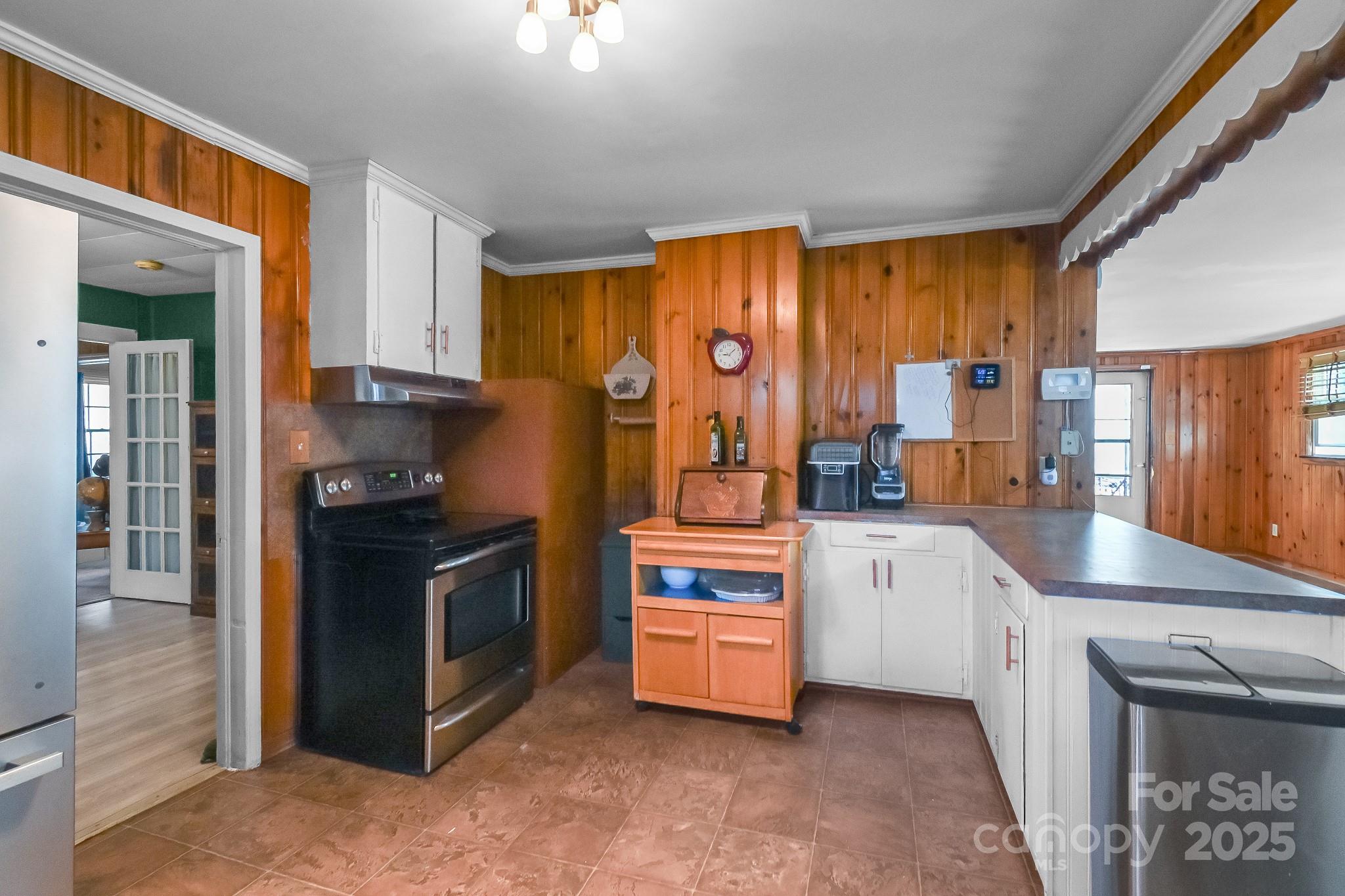 508 Old York Road Chester, SC 29706 - Photo 37 of 48 a kitchen with white cabinets and appliances