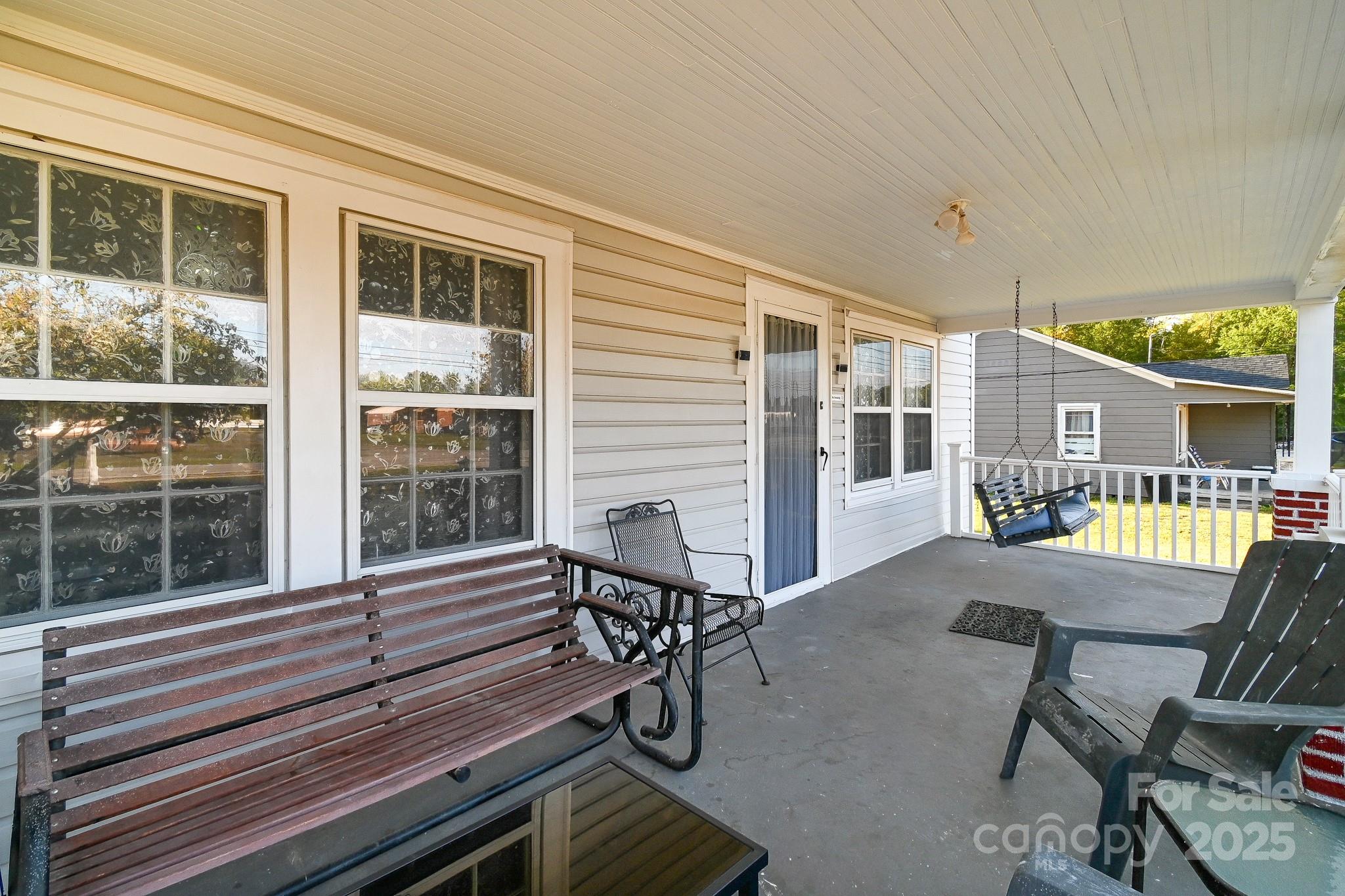 508 Old York Road Chester, SC 29706 - Photo 9 of 48 a view of a patio with table and chairs with wooden floor and fence