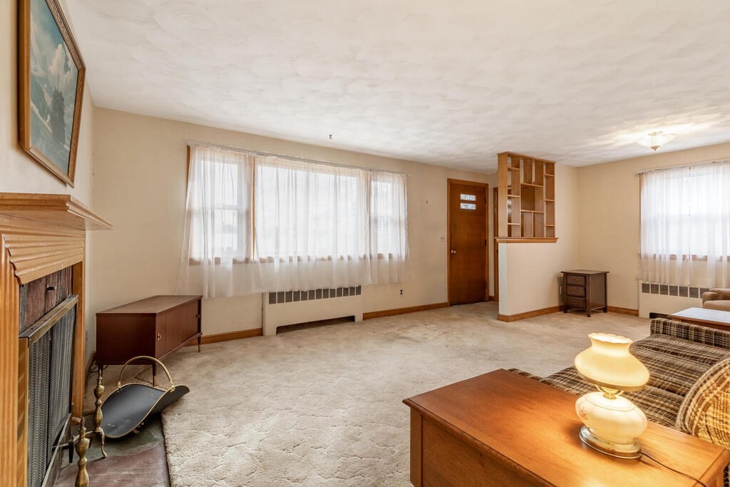 21 Roman Road Woburn, MA 01801 - Photo 20 of 29 a view of a livingroom with workspace and a window