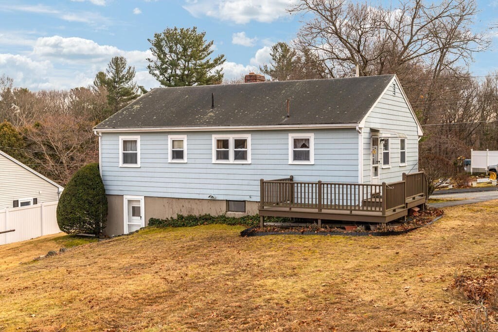 21 Roman Road Woburn, MA 01801 - Photo 23 of 29 a view of a house with a yard and garage