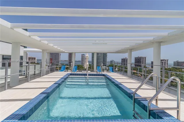 a view of a living room and kitchen