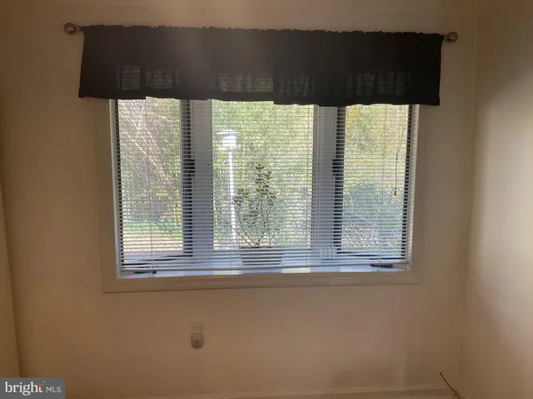 a view of a glass door and a window