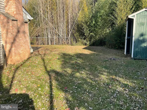 a view of a backyard of the house