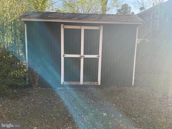 a view of a backyard of the house