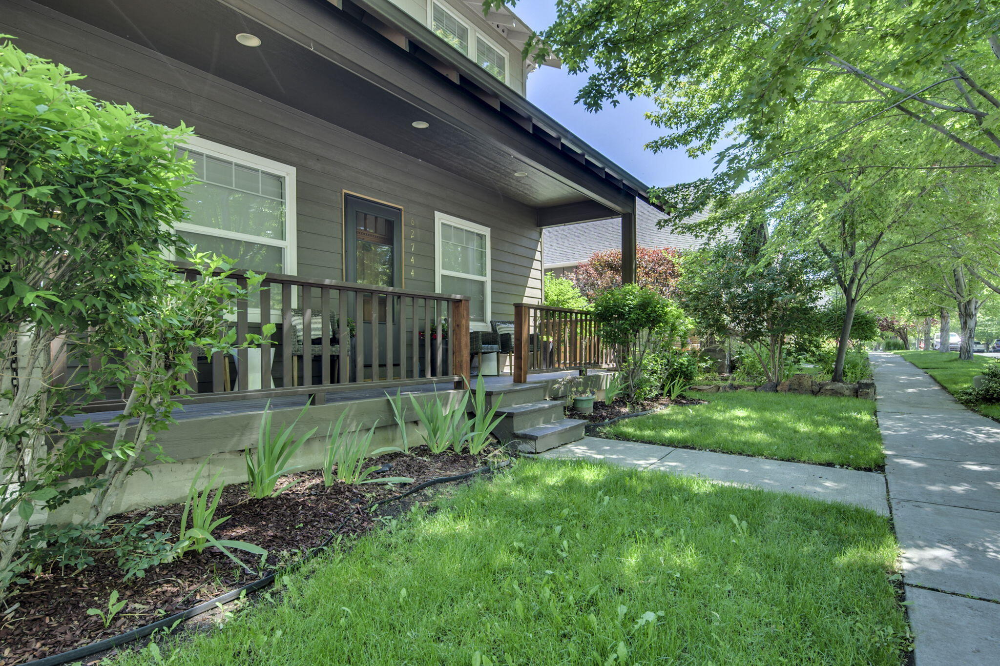 62744 Larkview Road Bend, OR 97701 - Photo 3 of 25 a view of a house with a yard and plants