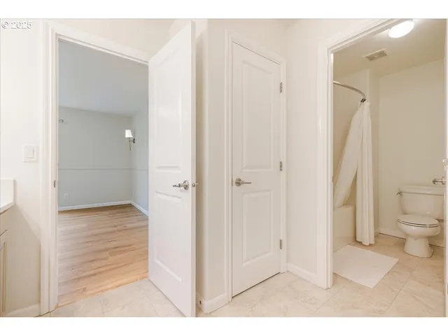 a bathroom with a shower and a toilet