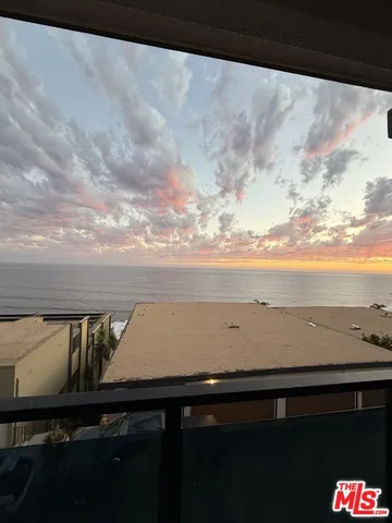 a view of outside space with wooden floor and city view