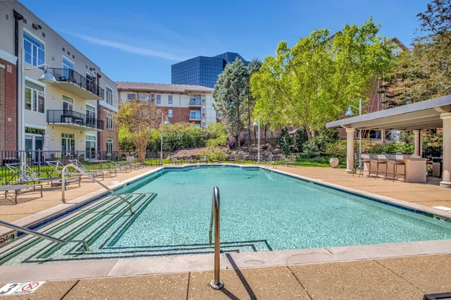 a view of a swimming pool with a patio