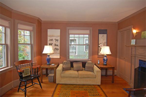 226 Upland Road Cambridge, MA 02140 - Photo 13 of 26 a living room with furniture a fireplace and a large window