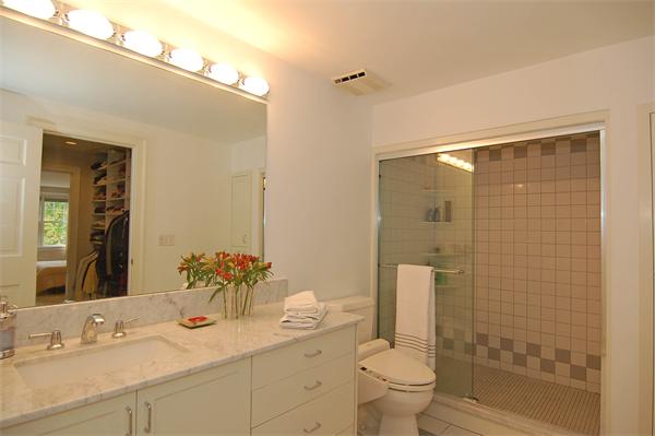 226 Upland Road Cambridge, MA 02140 - Photo 19 of 26 a bathroom with a granite countertop sink a toilet and shower