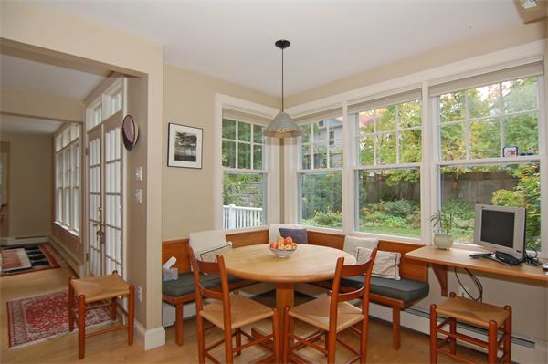 226 Upland Road Cambridge, MA 02140 - Photo 6 of 26 a dining room with furniture a chandelier and wooden floor