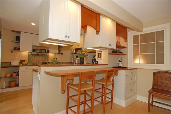 226 Upland Road Cambridge, MA 02140 - Photo 7 of 26 a kitchen with stainless steel appliances granite countertop a stove a sink and a refrigerator