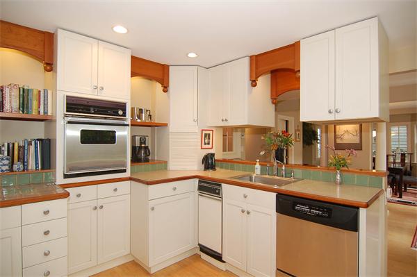 226 Upland Road Cambridge, MA 02140 - Photo 10 of 26 a kitchen with cabinets appliances and a sink