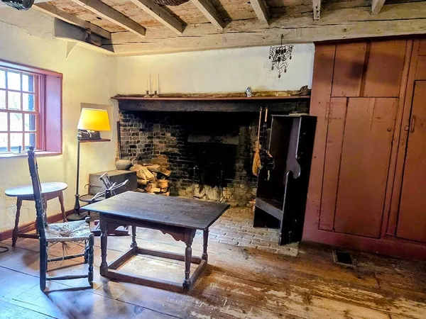 a kitchen with a sink a stove and wooden cabinets