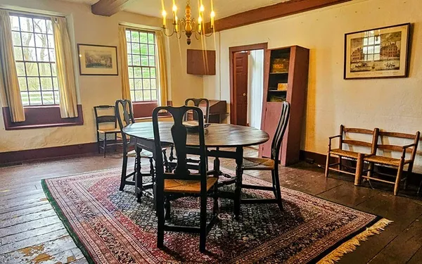 a view of a livingroom with furniture window and wooden floor