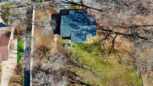 a aerial view of a house with a yard