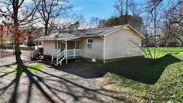 a view of a backyard with a patio
