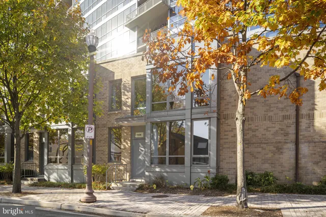 a front view of a building with tree s