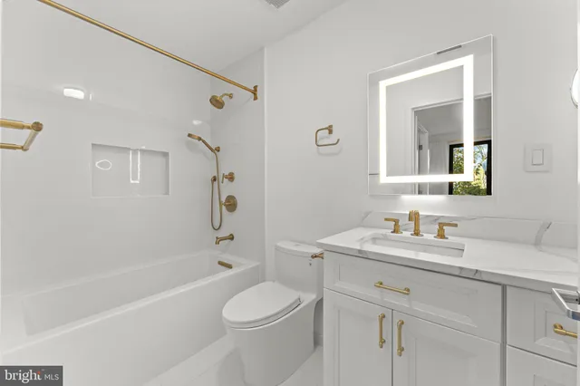 a kitchen with stainless steel appliances kitchen island granite countertop a table and chairs