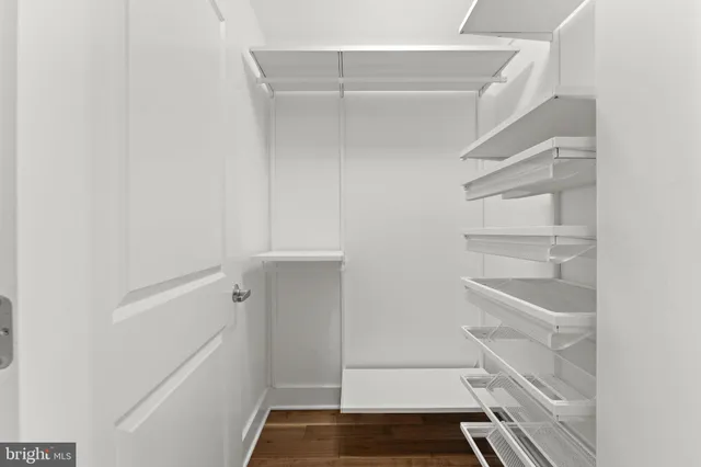 a view of parking garage with cars parked